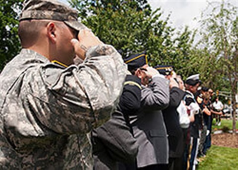 Veterans saluting at a Memorial Day ceremony